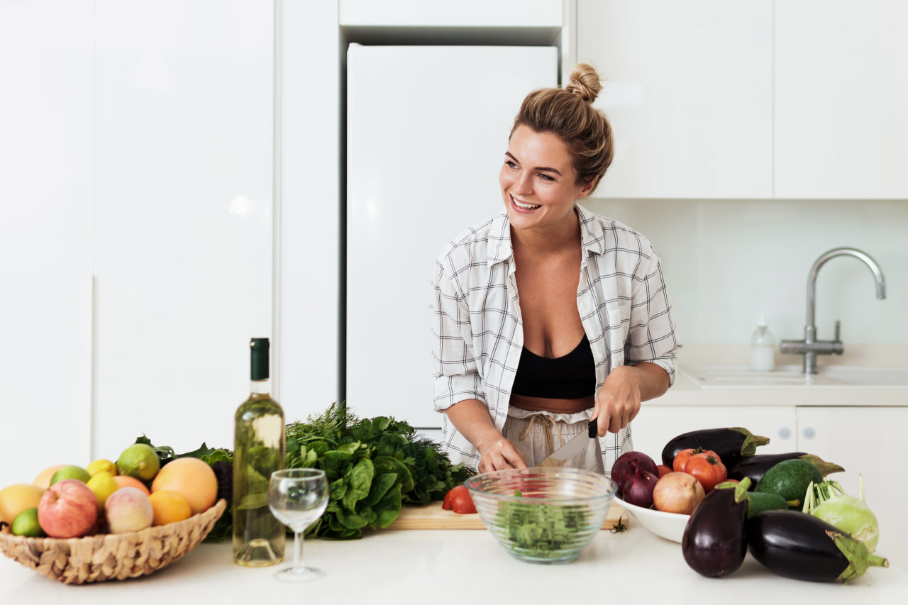 Illustration of a kitchen table with fresh, colourful food representing the Everyday Nutrition Guide team